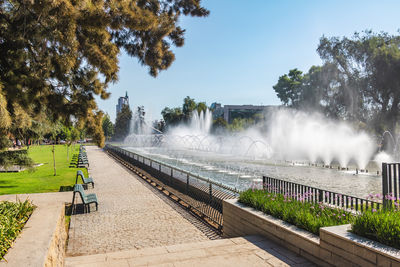 Scenic view of waterfall against sky