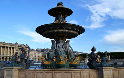 Statue of fountain against sky
