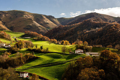 Scenic view of landscape and mountains against sky