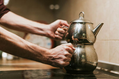 Cropped hand of man preparing food