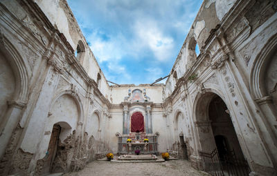 Facade of historic building against sky