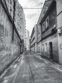 Road amidst buildings in city