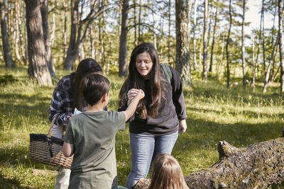 Family with children in forest