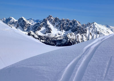 Scenic view of snowcapped mountains against sky