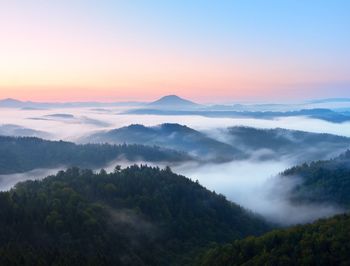 Scenic view of mountains against sky during sunset