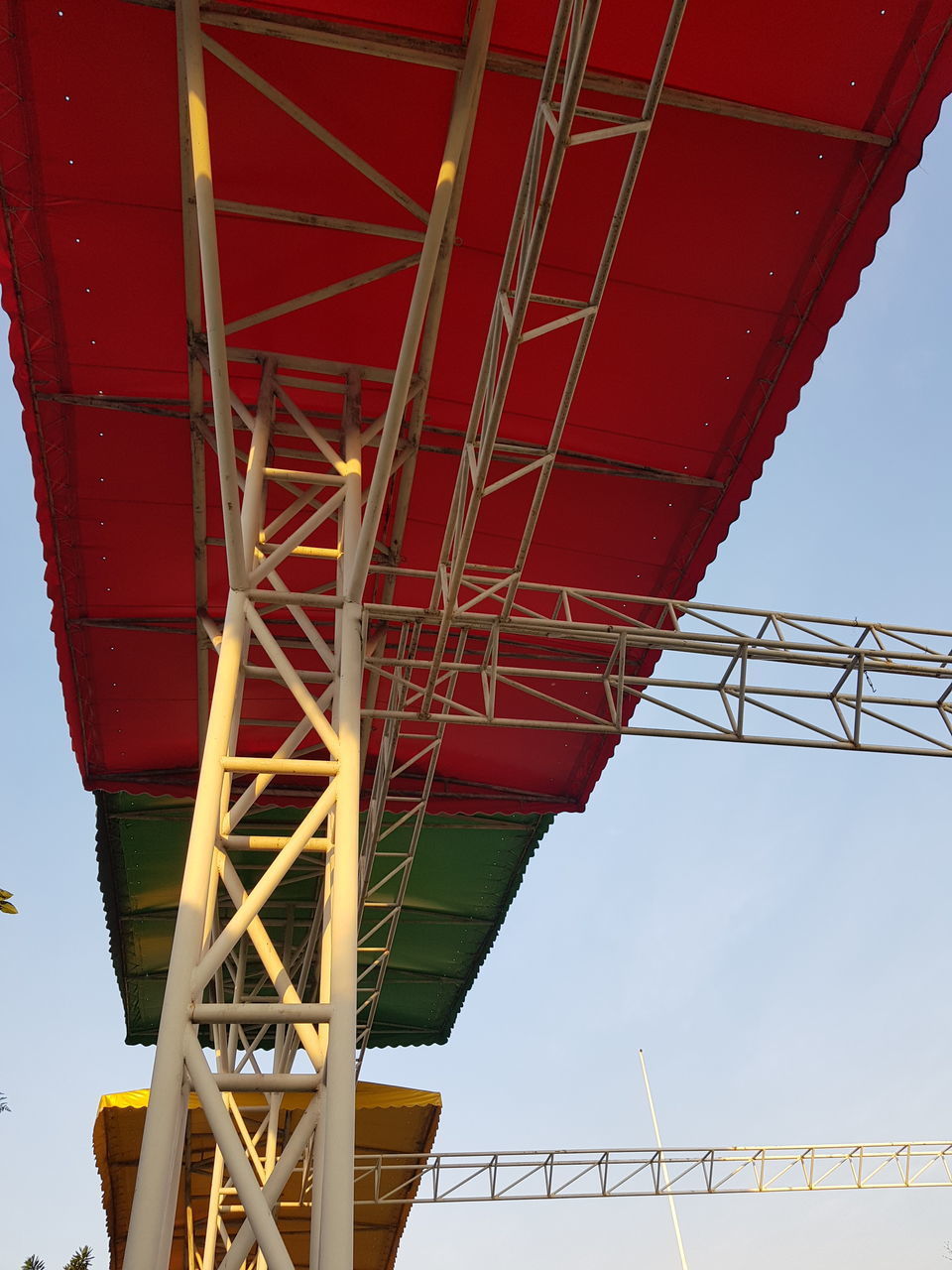 LOW ANGLE VIEW OF CRANE AT CONSTRUCTION SITE AGAINST SKY