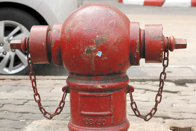 Close-up of fire hydrant on street in city