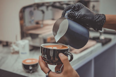Midsection of woman holding coffee