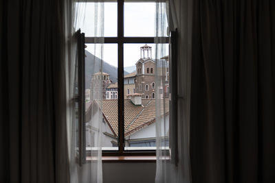 Buildings seen through window at home