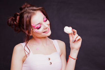 Close-up of young woman holding ice cream