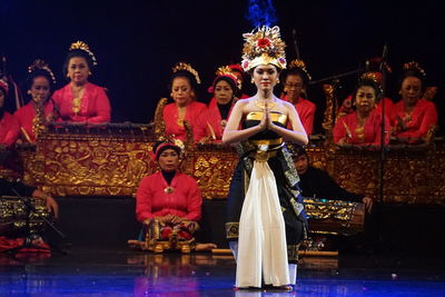 Group of people in traditional clothing at night