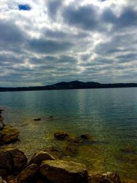 Scenic view of sea against cloudy sky