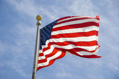 Low angle view of flag against sky