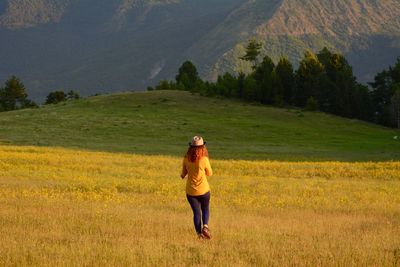 Full length of woman standing on field