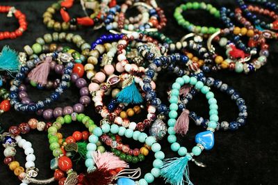 High angle view of colorful beaded bracelets at store