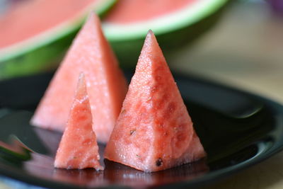 Close-up of triangle shape watermelons in plate on table