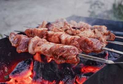 Close-up of meat on barbecue grill