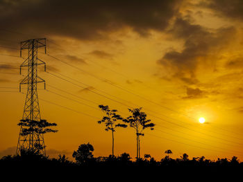 Golden sunset view with electricity tower and cloud formation fine art landscape