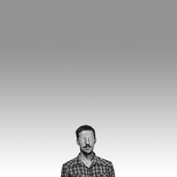 Digital composite image of blind man against gray background