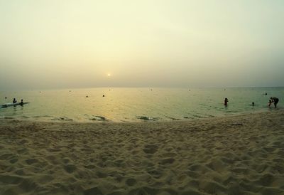 Scenic view of beach at sunset