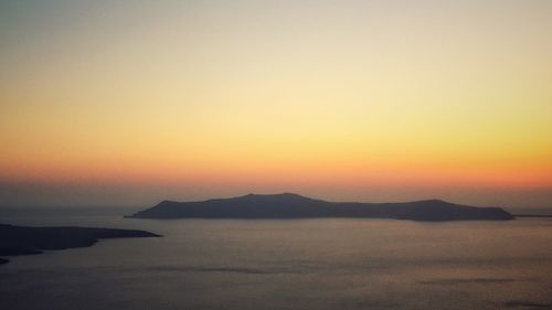 Scenic view of sea against orange sky