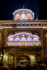 Low angle view of illuminated building at night