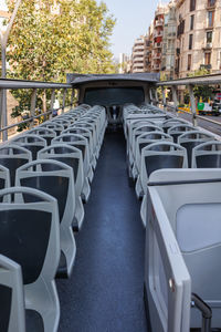 Empty bus seats of the upper deck of a double decker touristic bus.