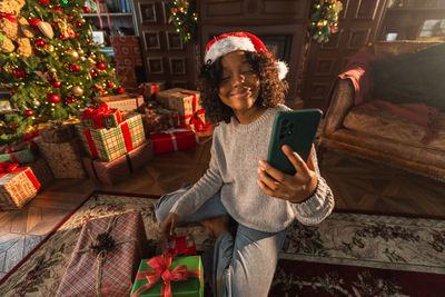 Rear view of man using mobile phone