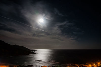 Scenic view of sea and moon at night