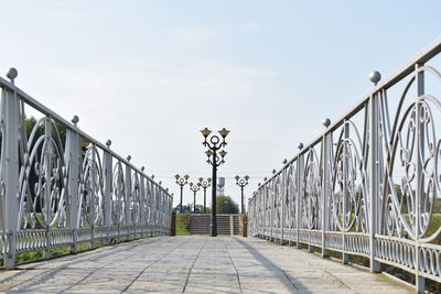 View of footbridge against sky