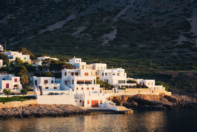 Kamares town with traditional white houses on sifnos island on sunset. greece