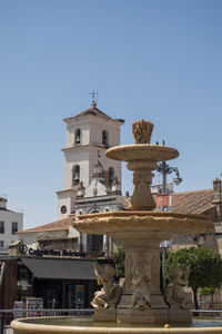 Statue of historic building against clear sky