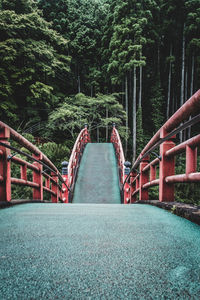 Footbridge against trees