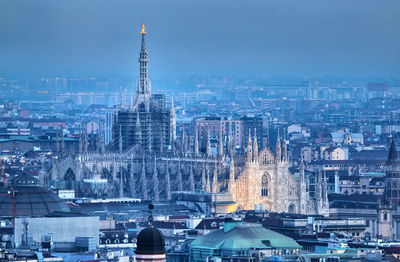 Aerial view of city lit up at night