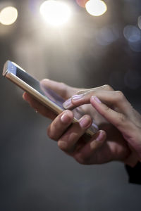 Close-up of woman hand holding smart phone