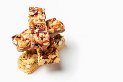 Stack of protein bars close-up on a white background copy space.