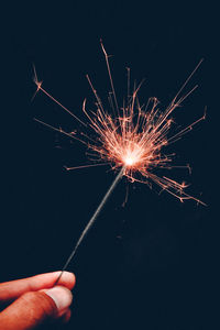 Low angle view of firework display at night