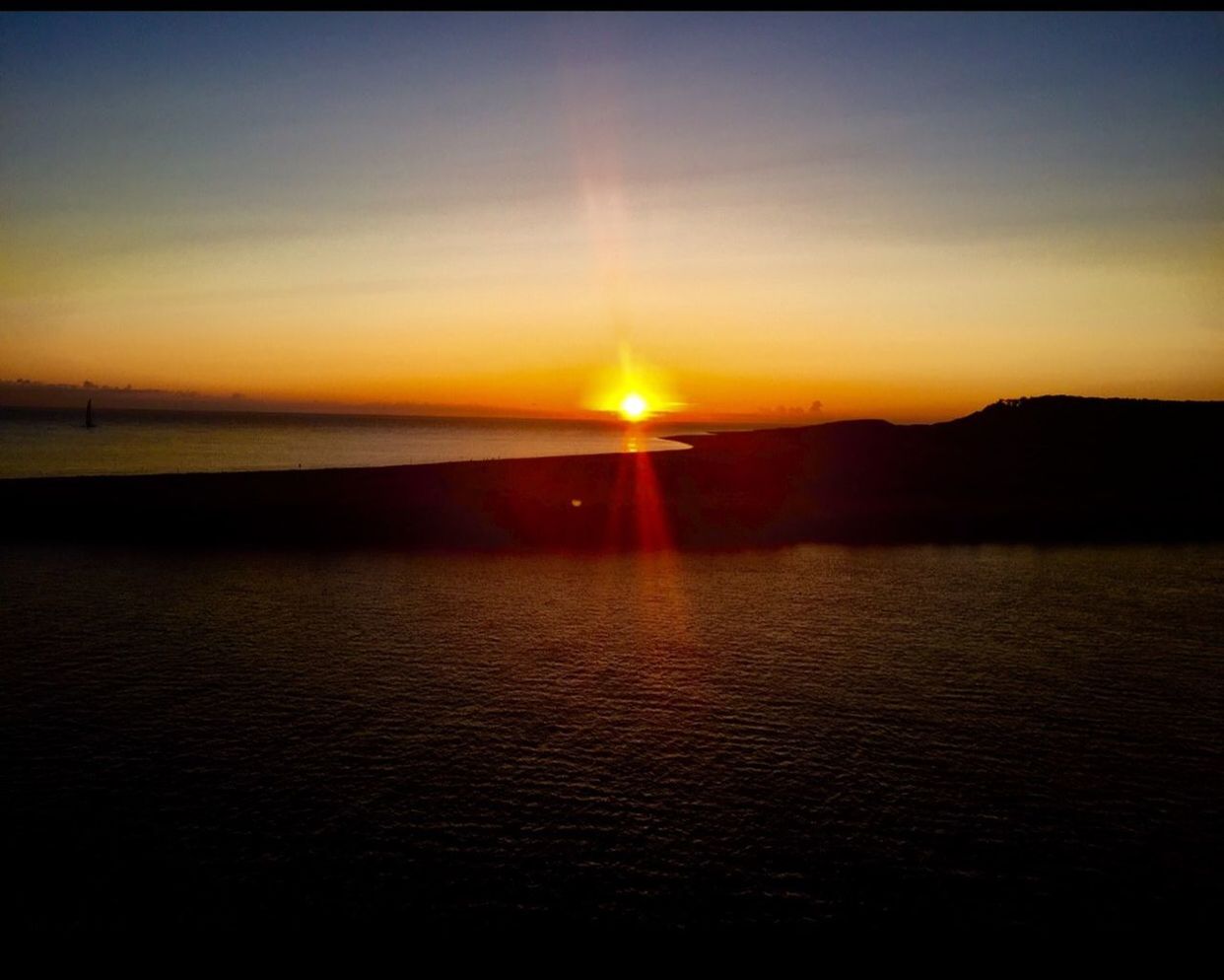 sunset, sun, water, sea, tranquil scene, scenics, tranquility, beauty in nature, orange color, silhouette, sunlight, idyllic, horizon over water, sky, reflection, nature, lens flare, rippled, waterfront, sunbeam