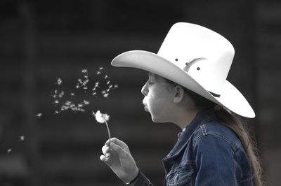 Portrait of boy holding cigarette