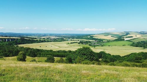 Countryside landscape against blue sky