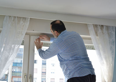 Low angle view of man working at home