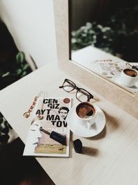 High angle view of coffee cup on table