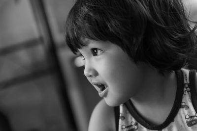 Close-up portrait of cute boy at home