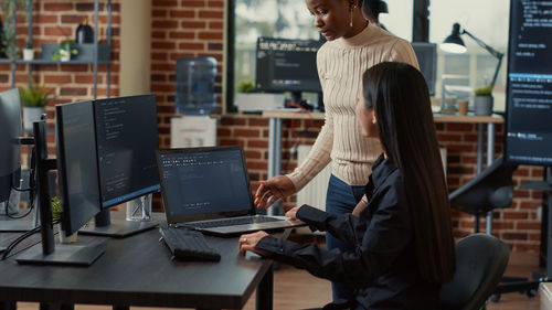 Computer programmer brainstorming at office