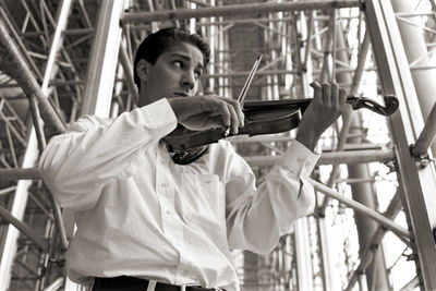 Portrait of young man holding outdoors