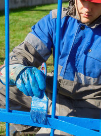 Midsection of man standing in playground