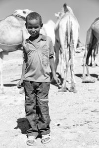 Full length of boy standing on field