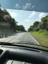 Road seen through car windshield