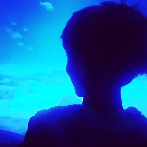 Close-up portrait of silhouette man in sea