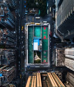 Directly above shot of stadium amidst buildings in city